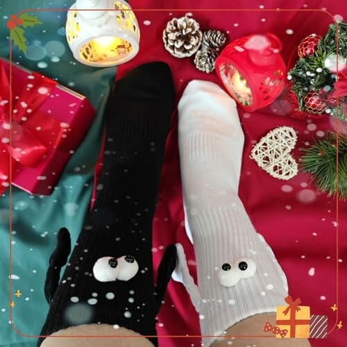 Feet wearing mismatched black and white socks with cute designs, surrounded by festive holiday decorations.