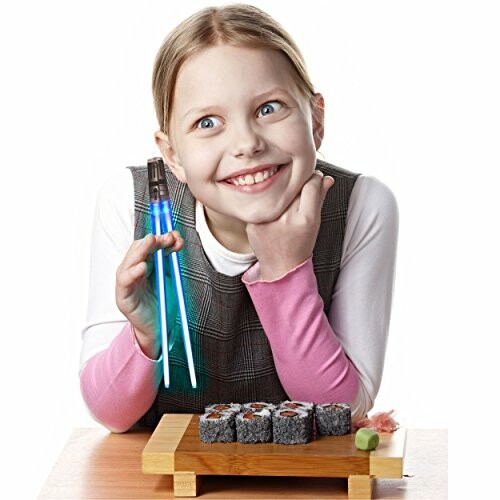 Girl holding light-up chopsticks with sushi